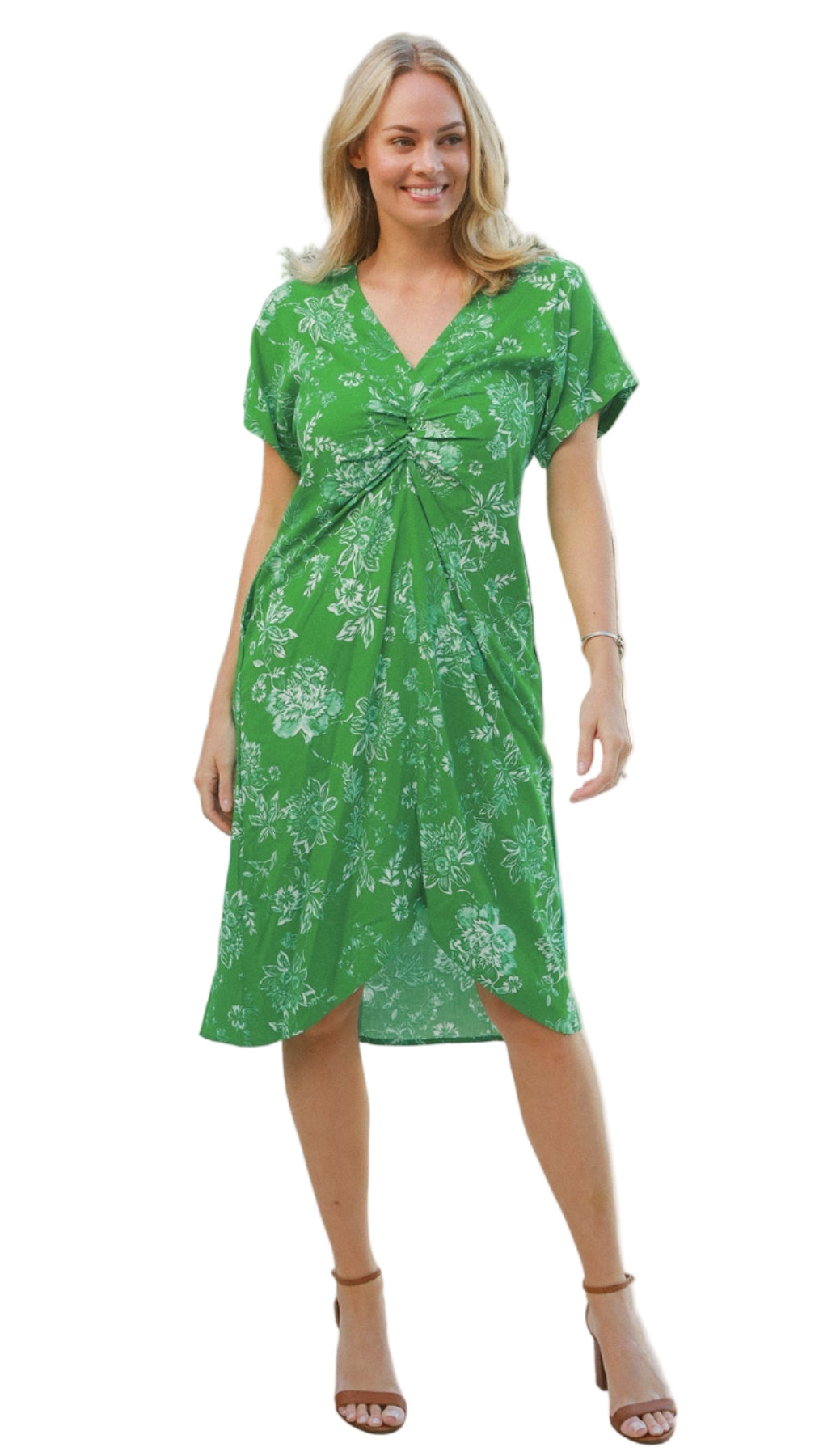 Woman wearing a green floral dress on a white background