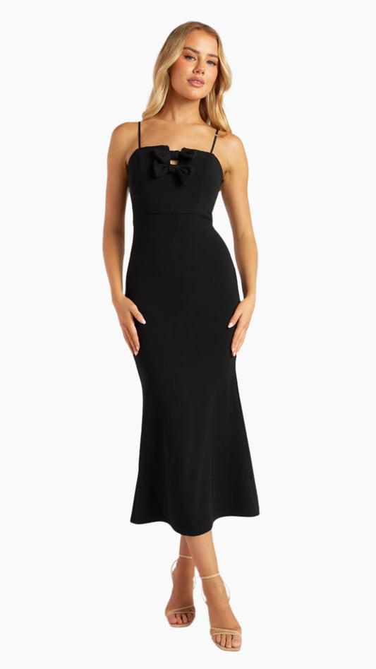 Full-length view of black strapless dress with adjustable straps and bow accents
