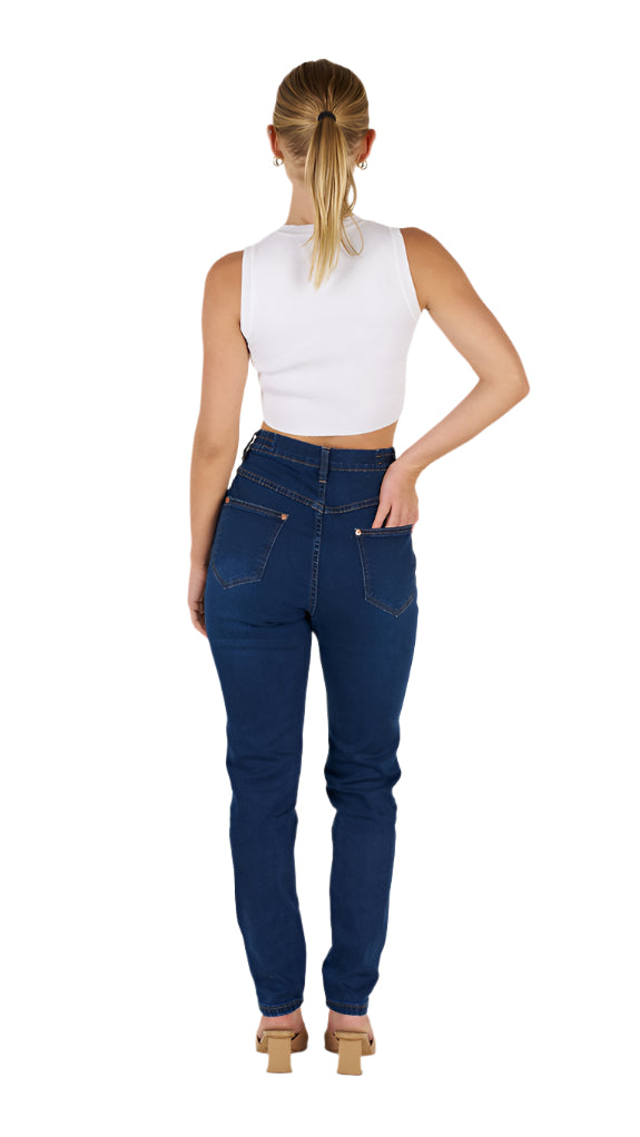 Woman wearing blue jeans and a white top on a white background