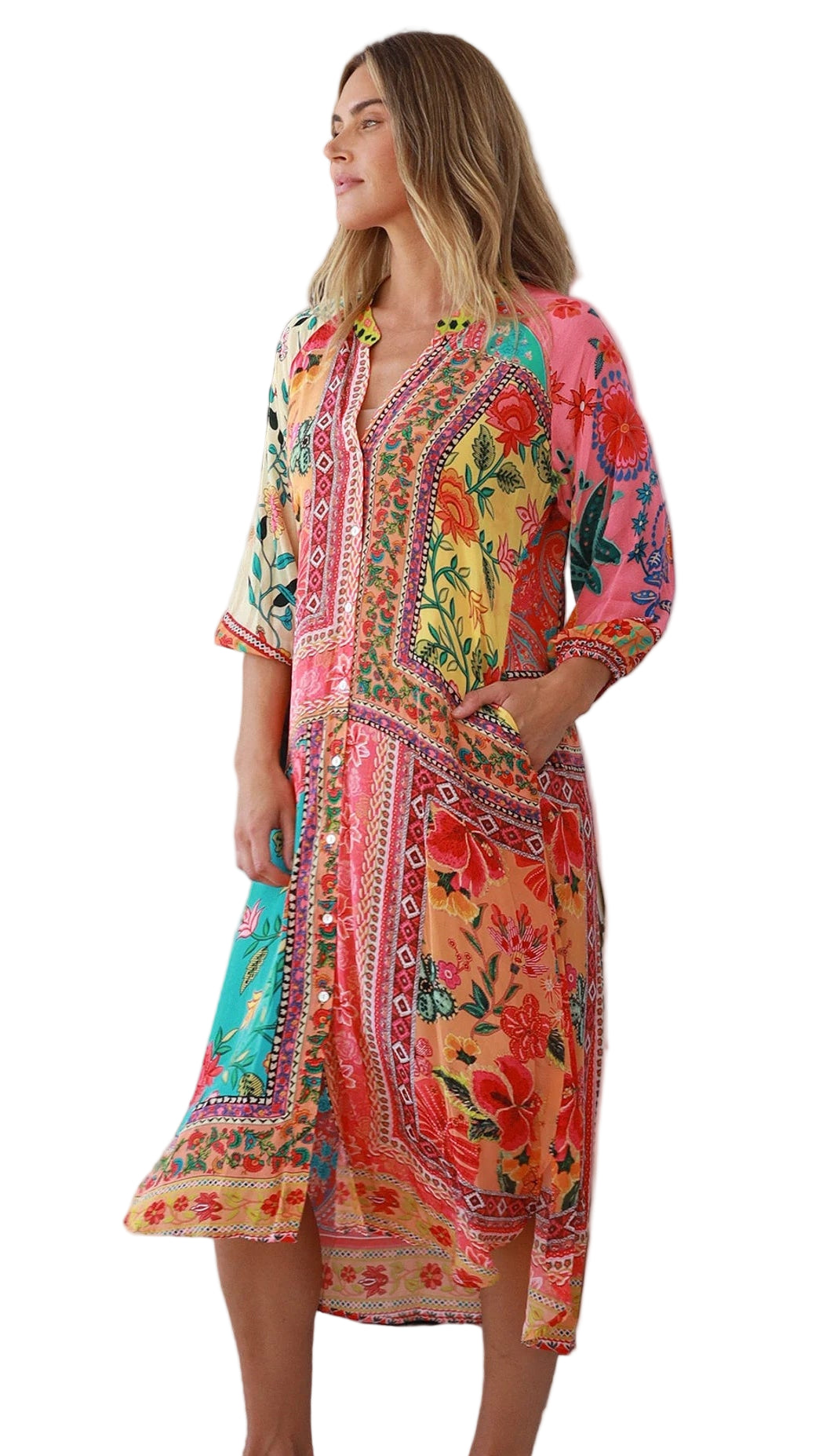 Woman wearing a colorful floral dress on a white background