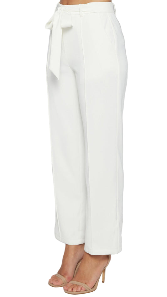 White wide-leg pants with a tie waist on a light gray background
