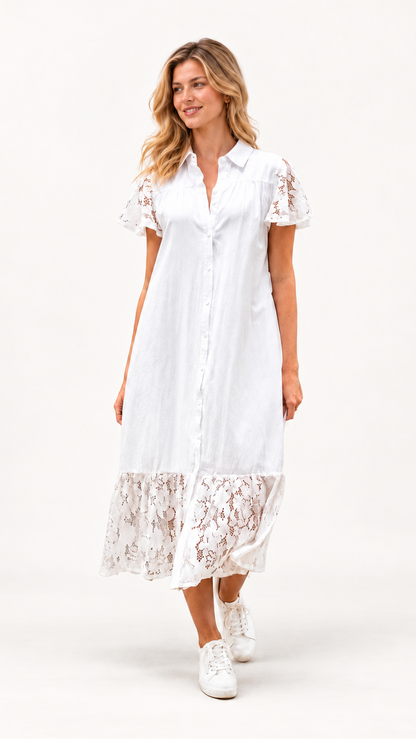 A woman modeling a white short-sleeve midi shirt dress with lace trim on the sleeves and hem, paired with white sneakers, against a plain white studio background.