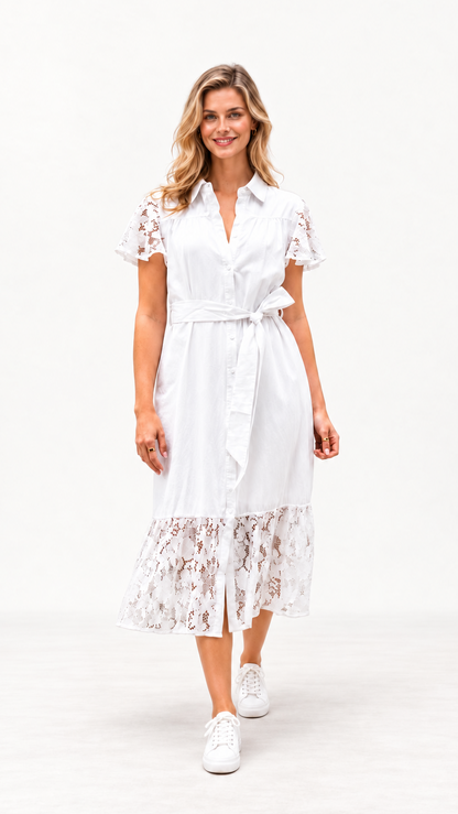 A woman modeling a white midi shirt dress with short lace flutter sleeves, a tie waist, and a lace hem, paired with white sneakers, against a plain white studio background.