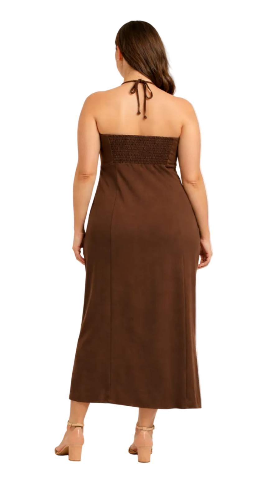 Rear view of Woman wearing a brown strapless dress on a white background