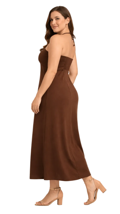 Side View of  Woman wearing a brown dress on a white background