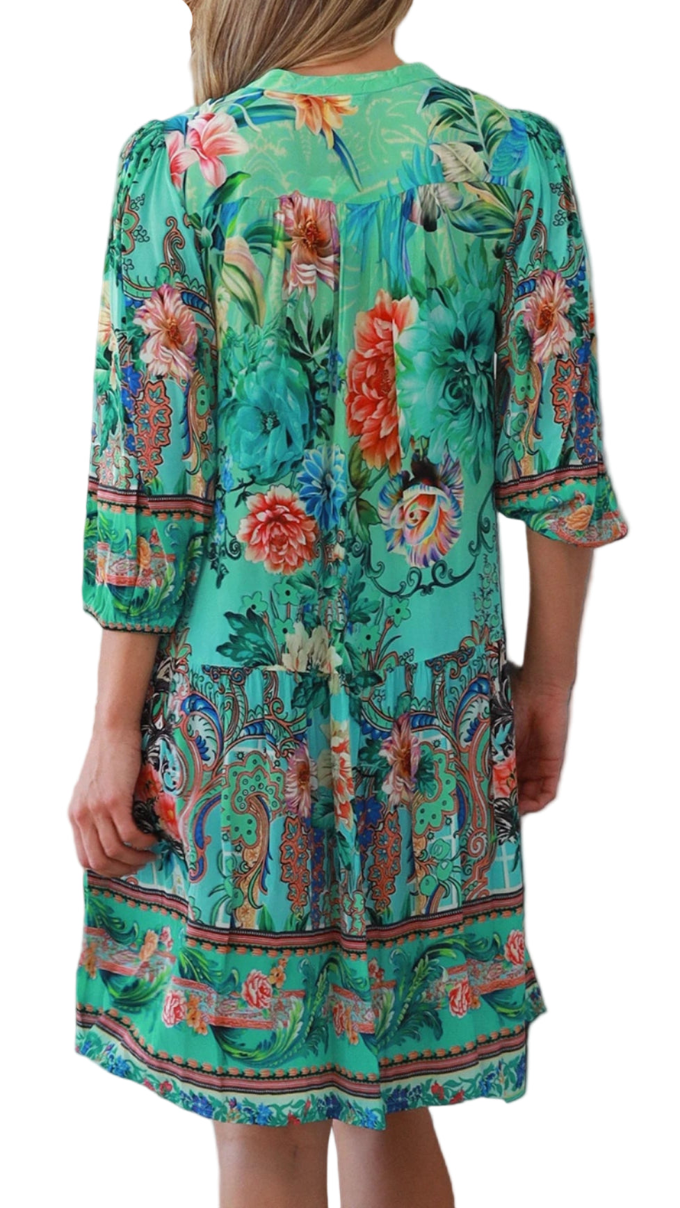 Woman wearing a colorful floral dress with a white background