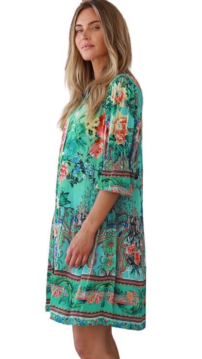 Woman wearing a floral dress with a white background