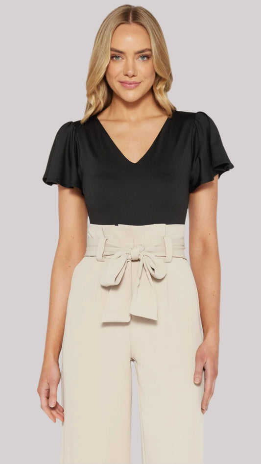 Black butterfly sleeve bodysuit styled with high-waist trousers