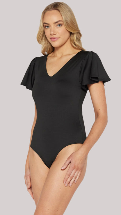 Model wearing black butterfly sleeve bodysuit side view