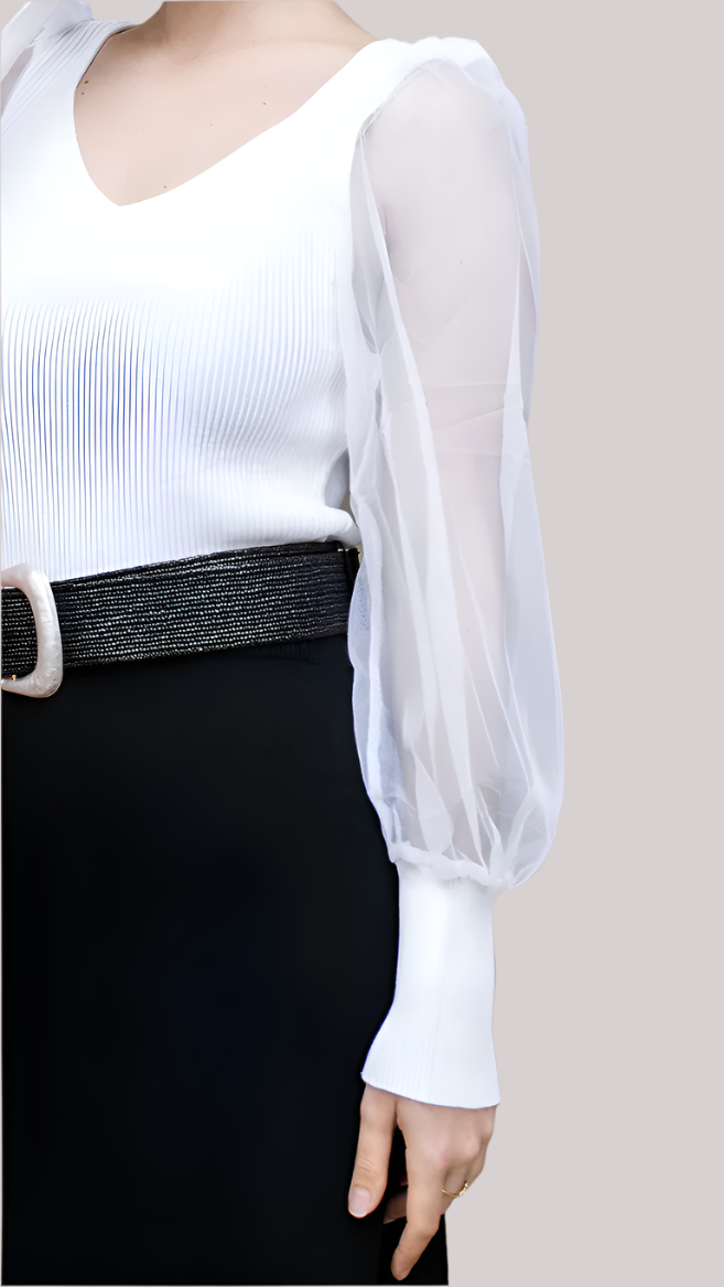 Close-up of sheer mesh sleeve and ribbed knit texture