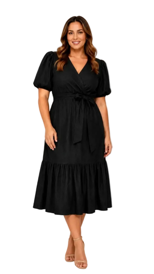 A woman modeling a black midi faux wrap dress with puff sleeves, a tie waist, and a tiered skirt, shown against a plain white background.
