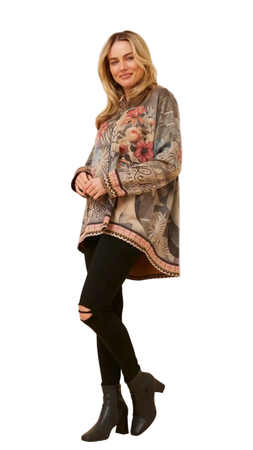 A woman modeling a bohemian-style long-sleeve hooded jacket with a complex paisley and floral print in earthy tones, paired with black ripped leggings and black ankle boots, against a plain white background.
