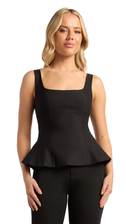 Midnight Refrain black peplum top with scoop neckline and fitted waist worn by model