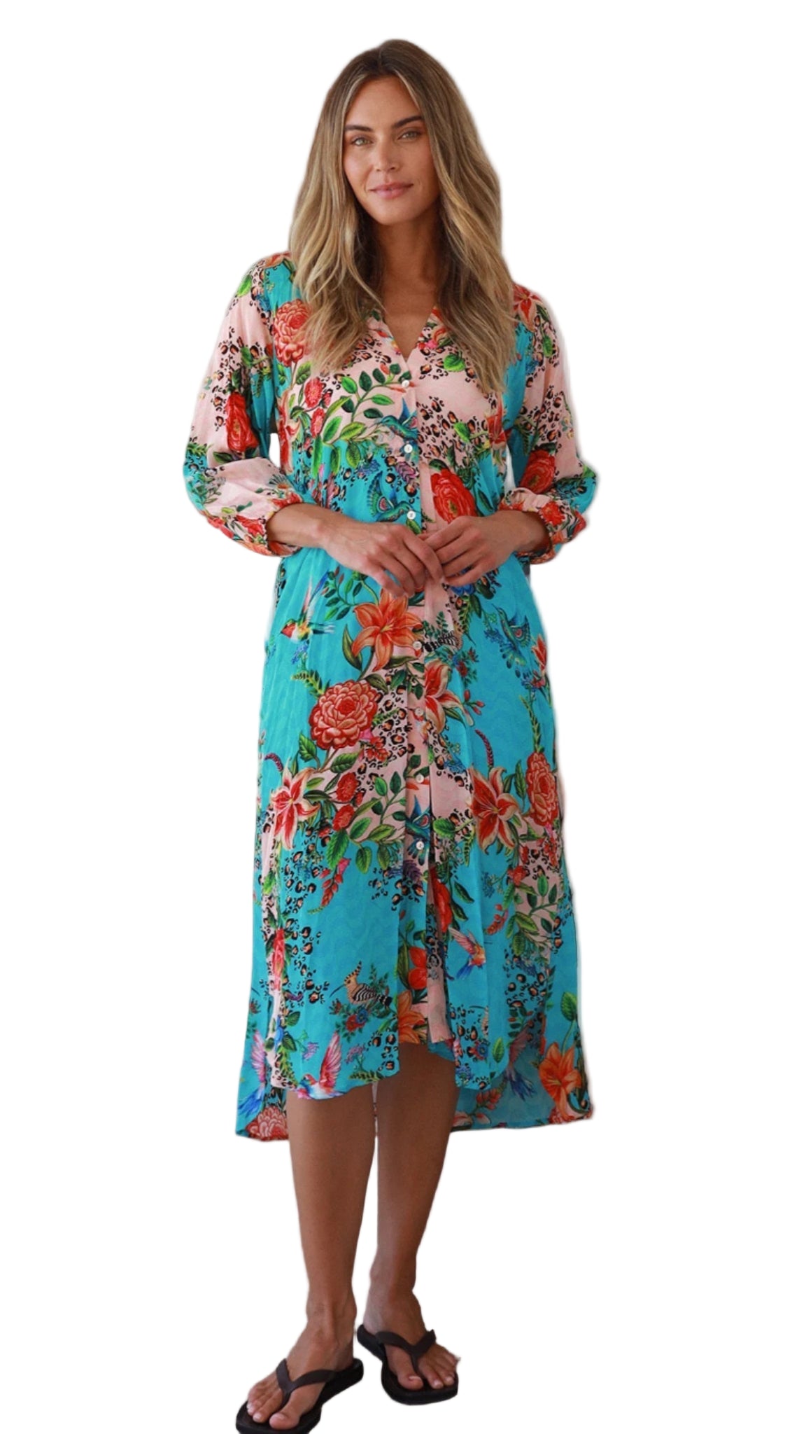 Woman wearing a colorful floral dress on a white background