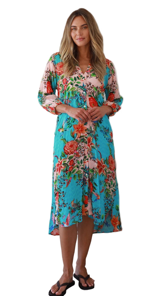 Woman wearing a colorful floral dress on a white background