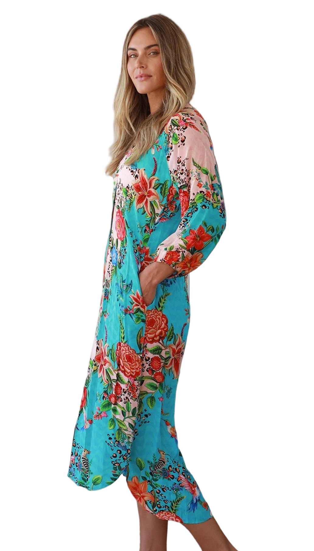 Woman wearing a colorful floral dress on a white background