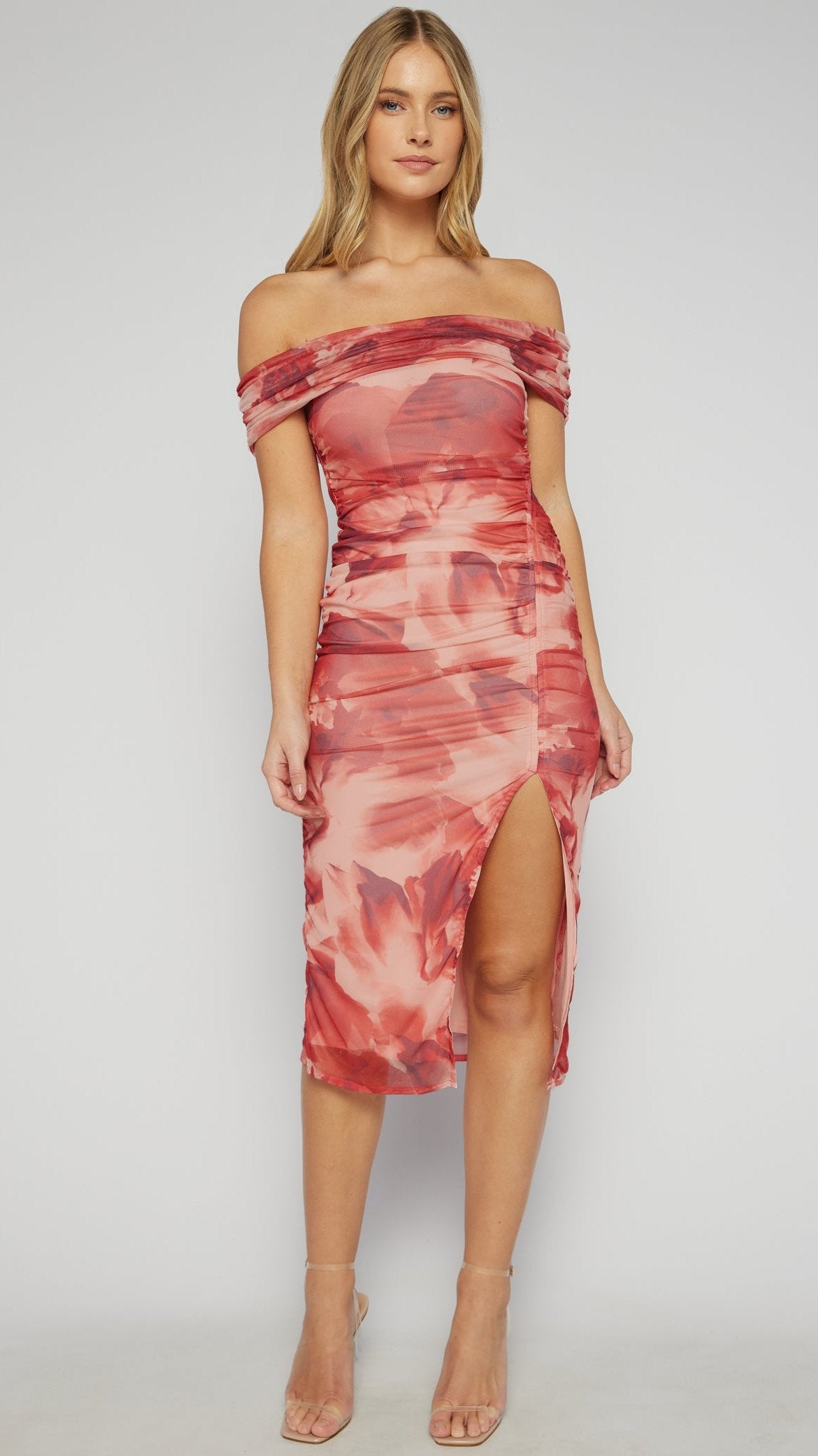 Side view of the Rose Allure Dress showcasing the abstract floral print and sleek leg split
