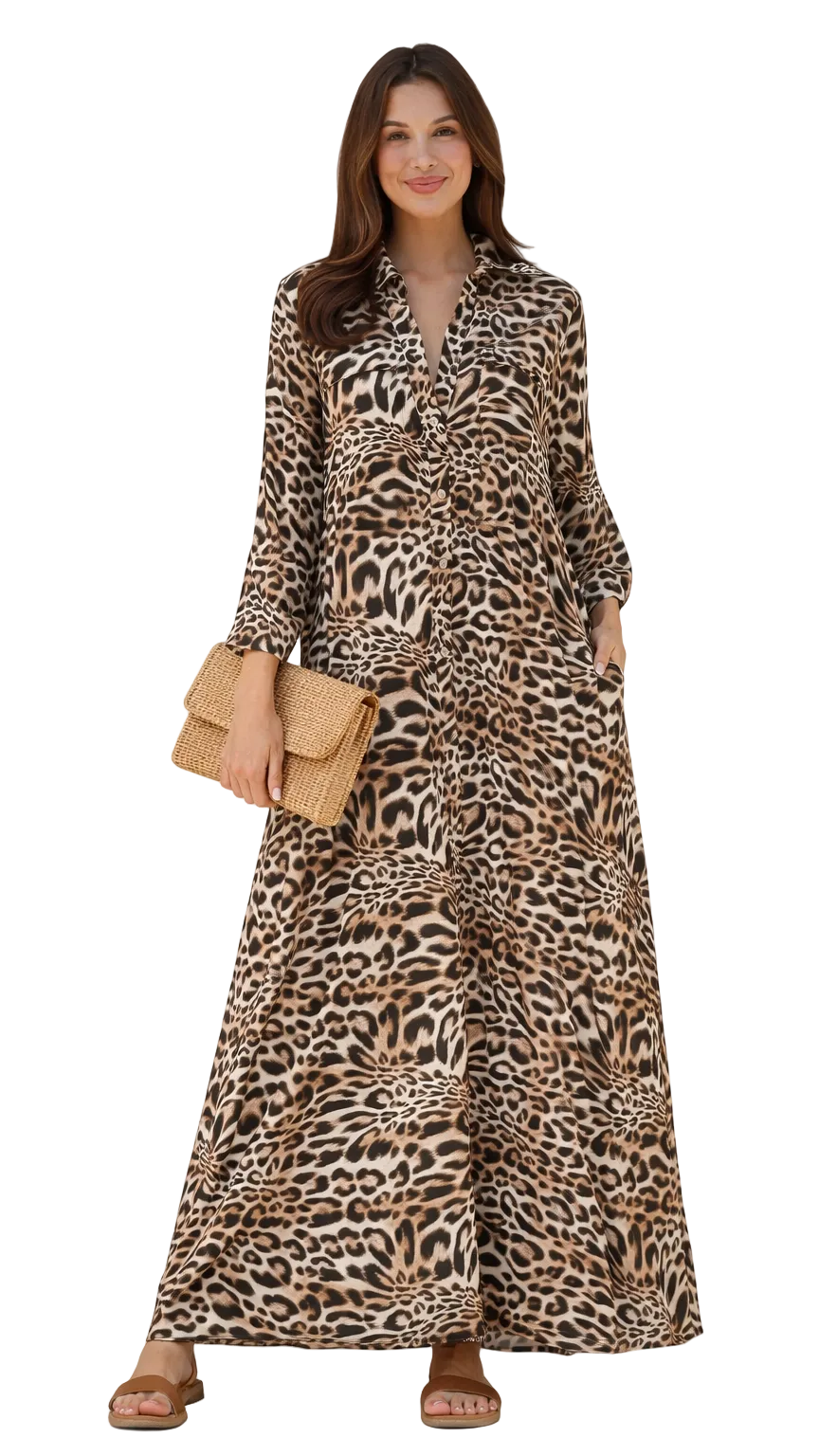 Savannah Chic leopard print shirt dress worn loose with long sleeves and flowing A-line silhouette, styled with neutral clutch and sandals.