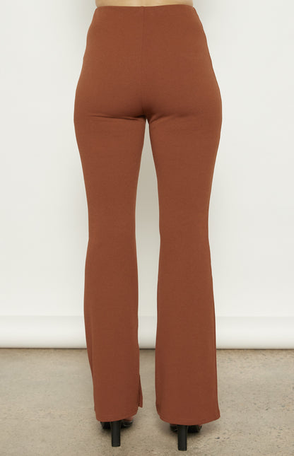 Back view of the Terra Flare Pants, showing the smooth, fitted waistline and relaxed flare shape.