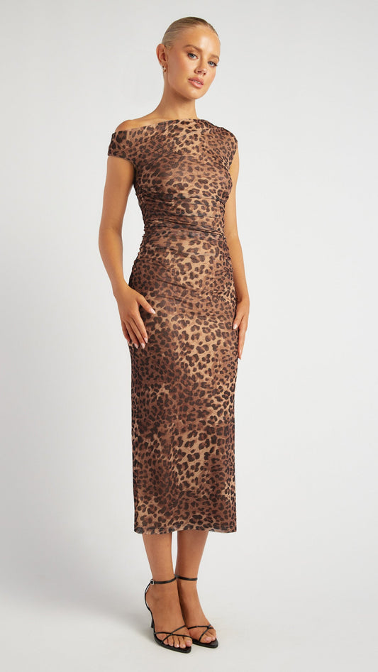 Front view of the Untamed Elegance Dress with leopard print and asymmetric neckline