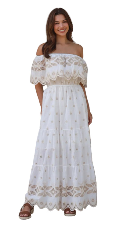 Valencia off-shoulder embroidered cotton maxi dress in white with scalloped hem detail.