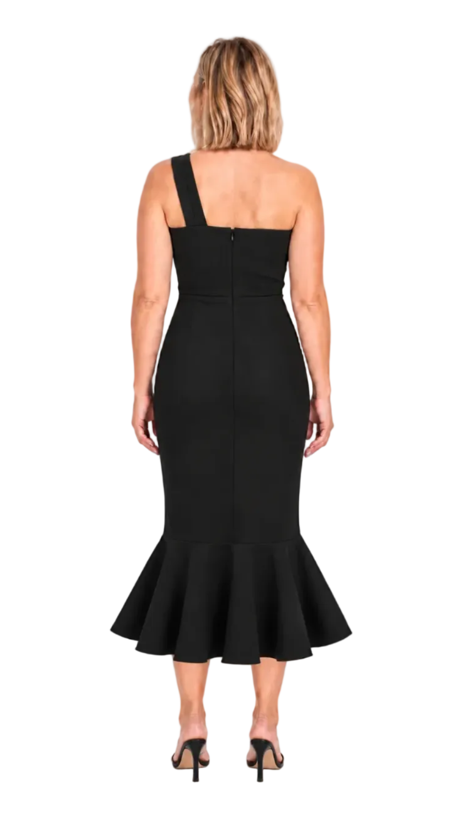 A woman viewed from the back wearing a black one-shoulder midi dress with a fitted bodice and flared ruffled hem, paired with black heeled sandals against a plain white studio background.